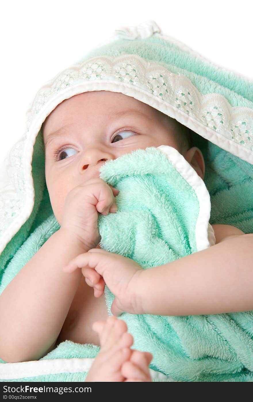 The child after bathing, lays turned in a towel. The child after bathing, lays turned in a towel