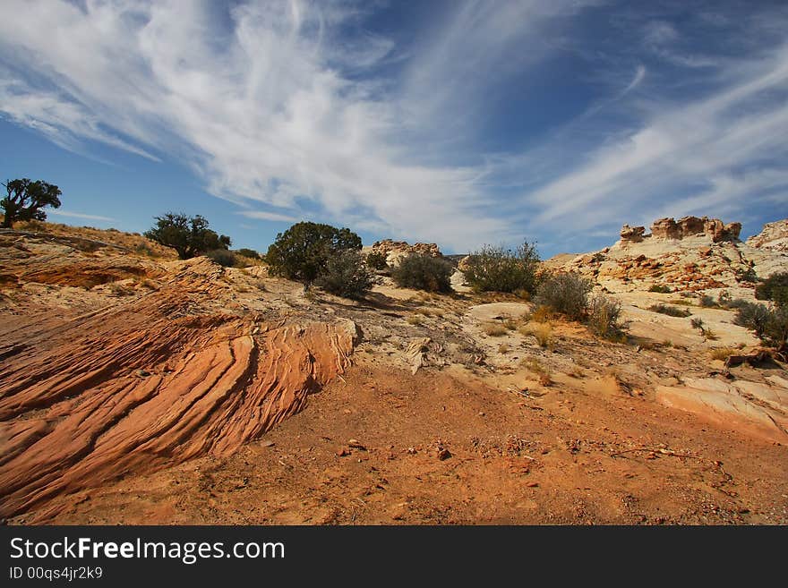 View of the red rock formations in Canyonlands National Park with blue sky�s and clouds. View of the red rock formations in Canyonlands National Park with blue sky�s and clouds