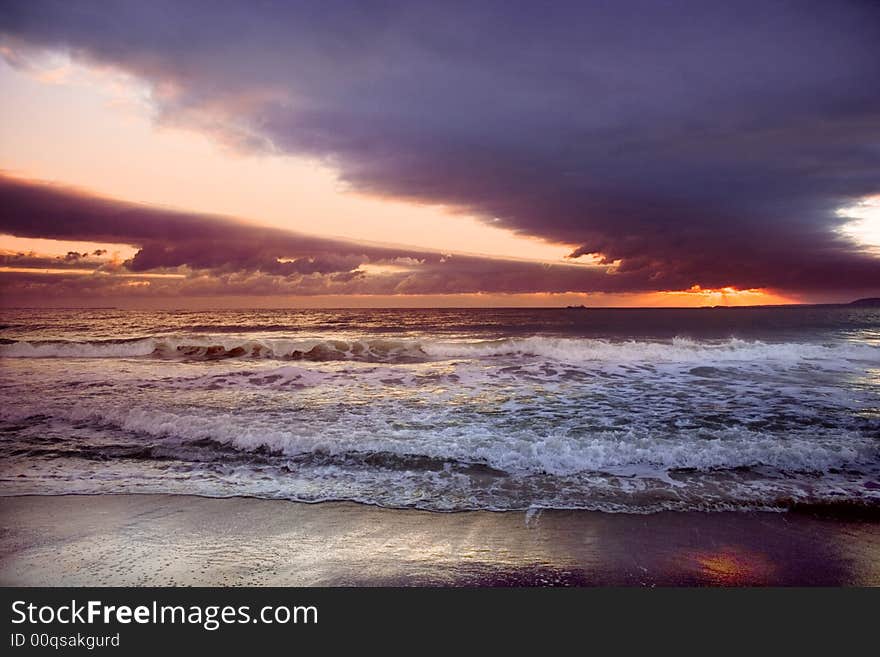 Black sea-Bulgaria-2008 It starts the new day. The sun punctures a road for itself in its oort clouds.Sunrise above the sea. Black sea-Bulgaria-2008 It starts the new day. The sun punctures a road for itself in its oort clouds.Sunrise above the sea