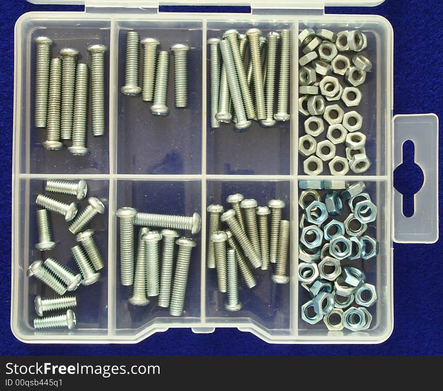 Organizer with several nuts and screws of different sizes. Organizer with several nuts and screws of different sizes