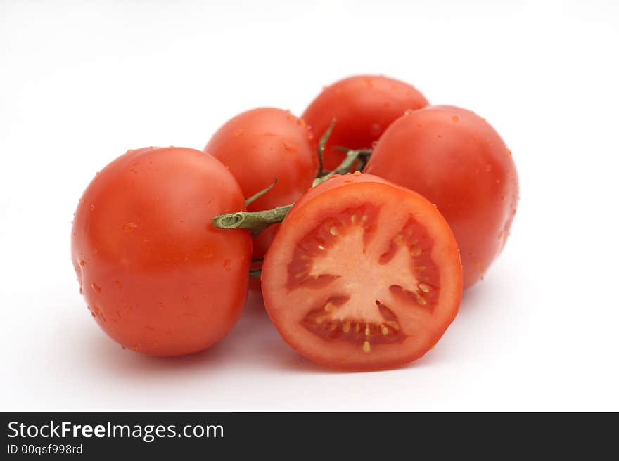 Red tomatoes on a white background