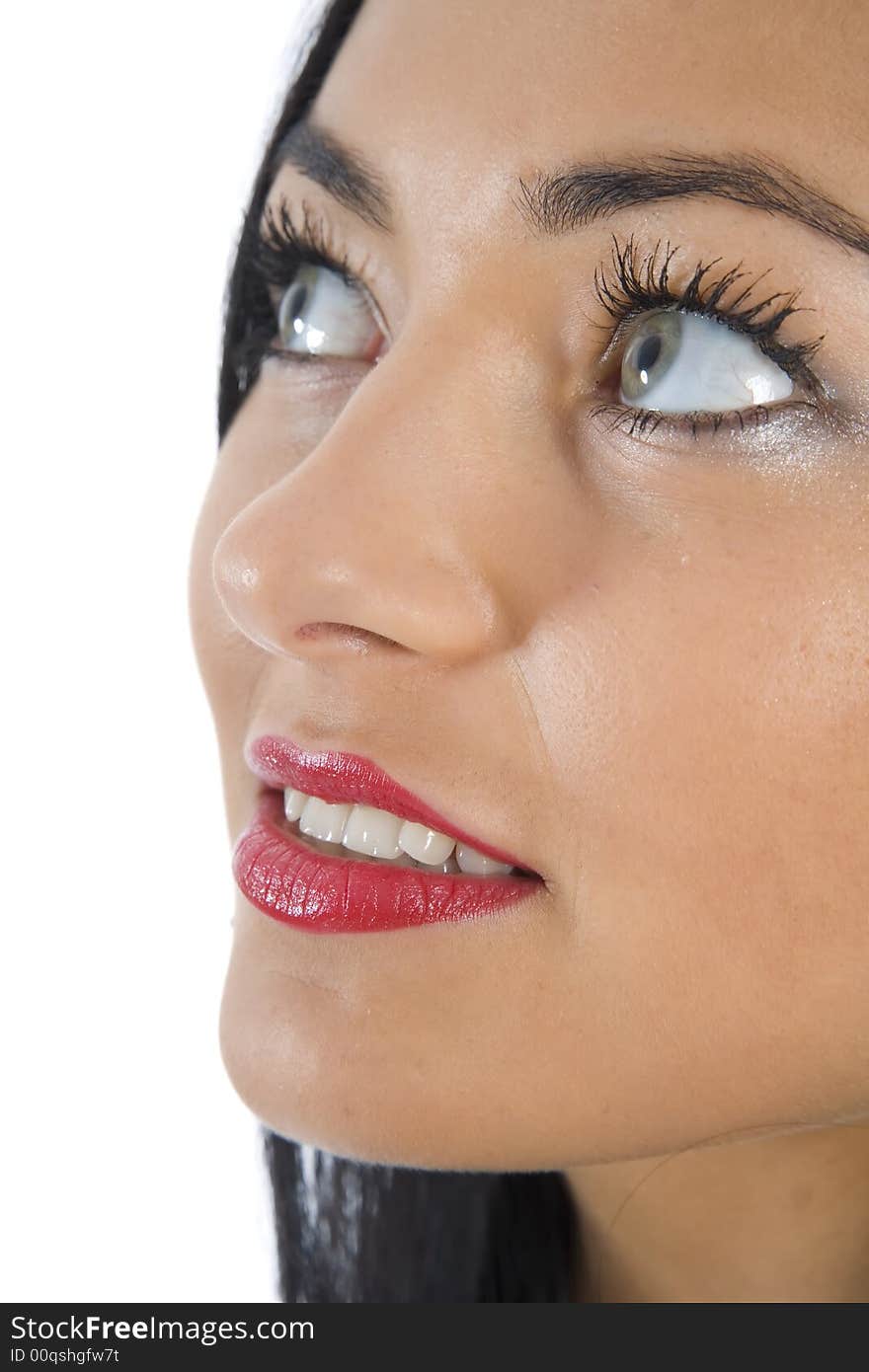 Portrait of the brunette with blue eye on insulated background