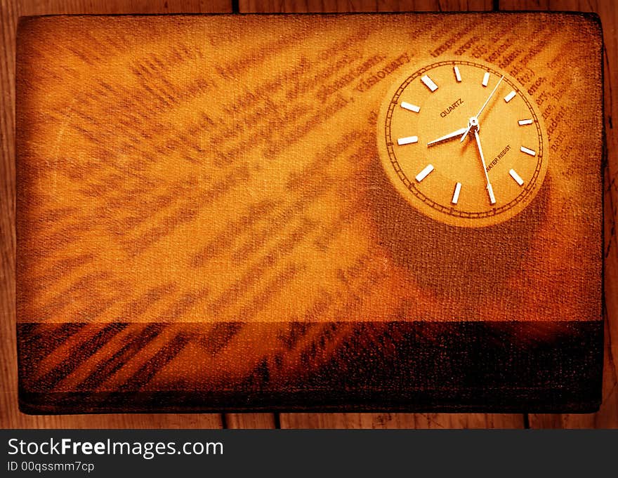 Close-up of old dictionary with clock