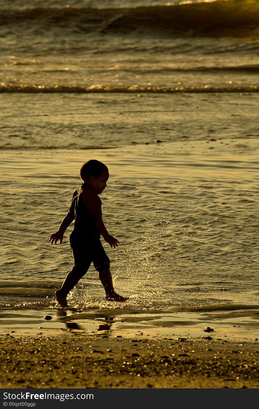 Boy playing in the waves. Boy playing in the waves