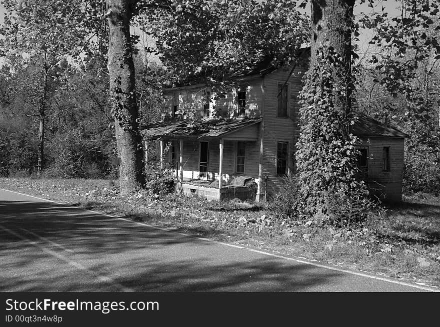 Black and white photo of an old abandoned house. Black and white photo of an old abandoned house