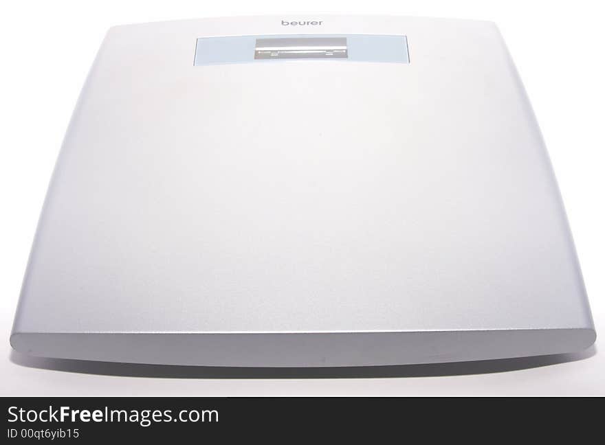 Weighing scales on white background.