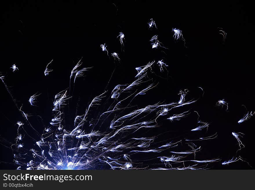 Beautiful black background with sparkling blue fireworks. Beautiful black background with sparkling blue fireworks