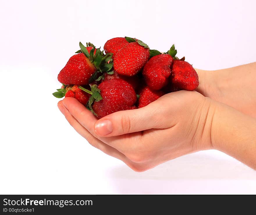 Strawberry in the hand on white backround