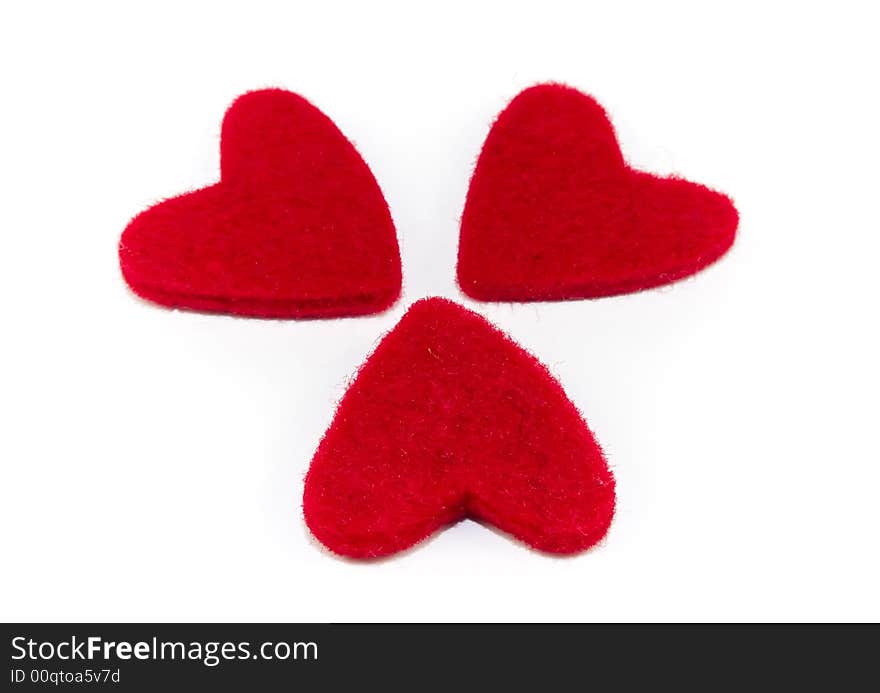 Three red hearts isolated