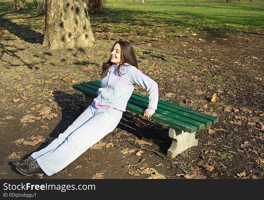 Pretty girl doing exercises outdoors