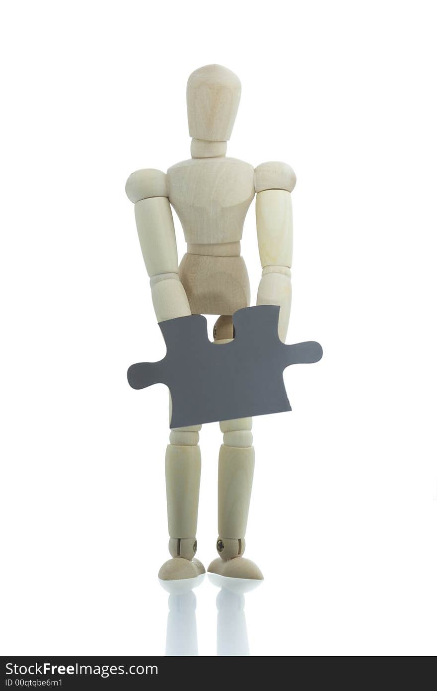 Manikin holds puzzle piece