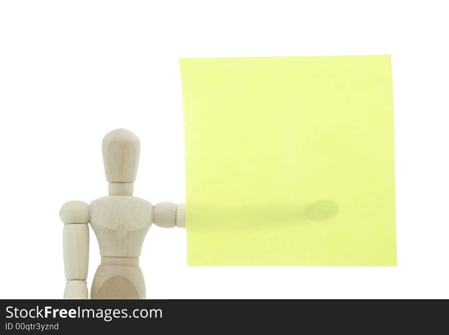 Manikin holds yellow note in hand. Manikin holds yellow note in hand