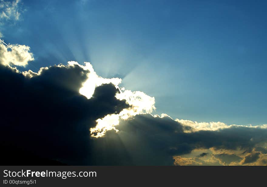 View of deep blue color sky with white and grey clouds. View of deep blue color sky with white and grey clouds