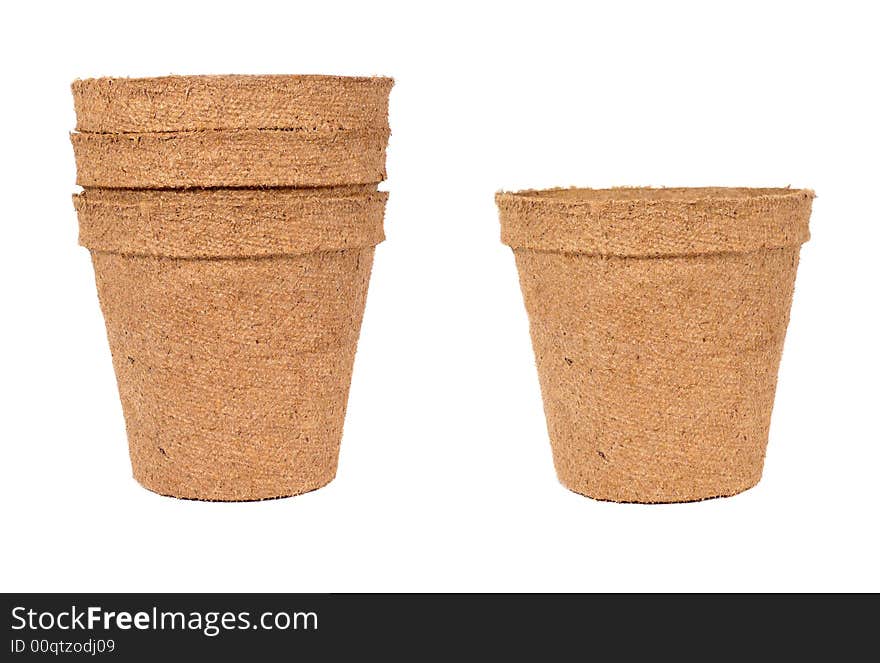 Single and stack of biodegradable planting pots isolated over a white background. Single and stack of biodegradable planting pots isolated over a white background