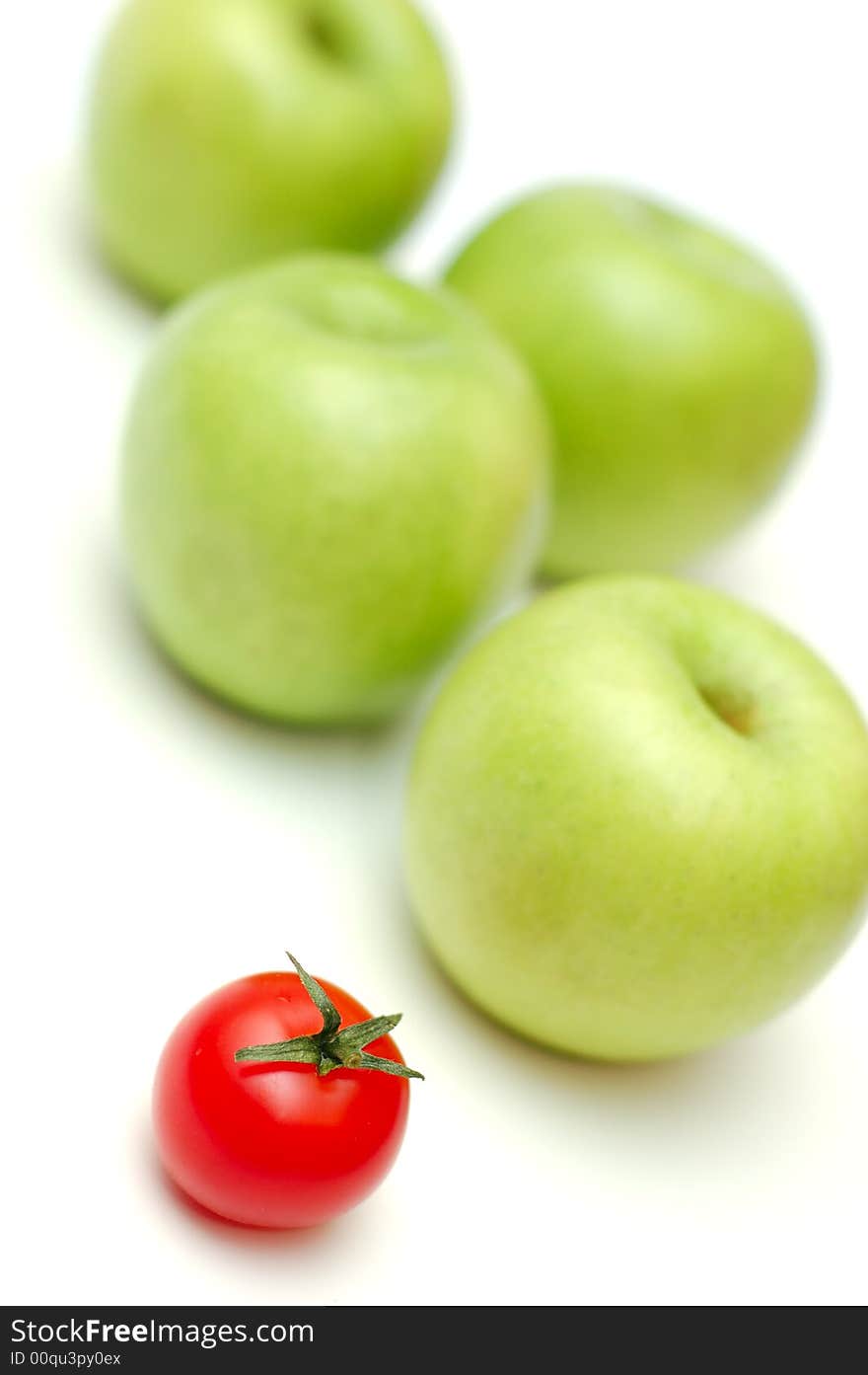 Red tomato and green apples