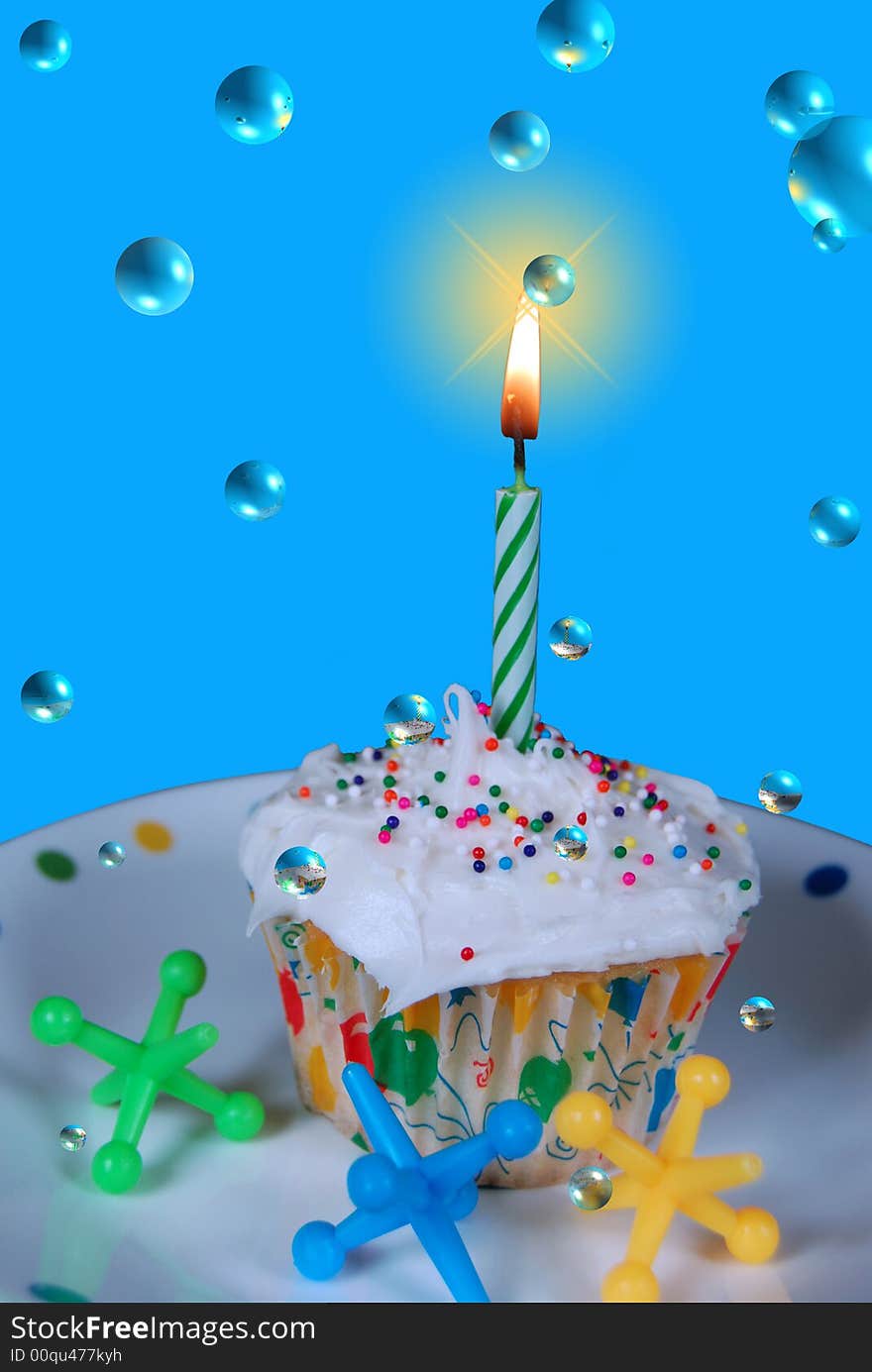 Single cupcake and candle on a fun plate with floating bubbles. Single cupcake and candle on a fun plate with floating bubbles.