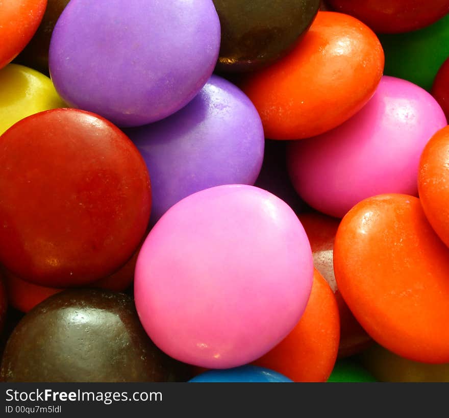 Background formed by a macro of chocolate coated candies. Background formed by a macro of chocolate coated candies