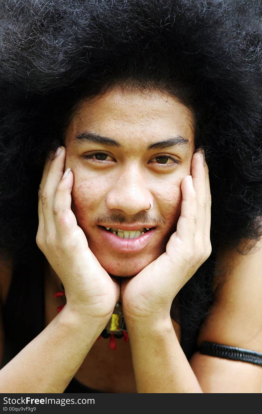 Close-up portrait of a young Thai man.