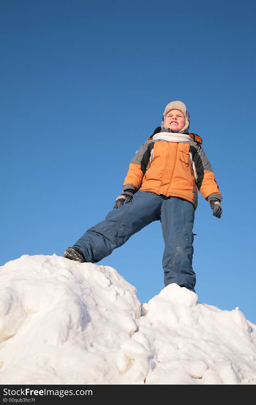 Boy Stands On Snow Hill