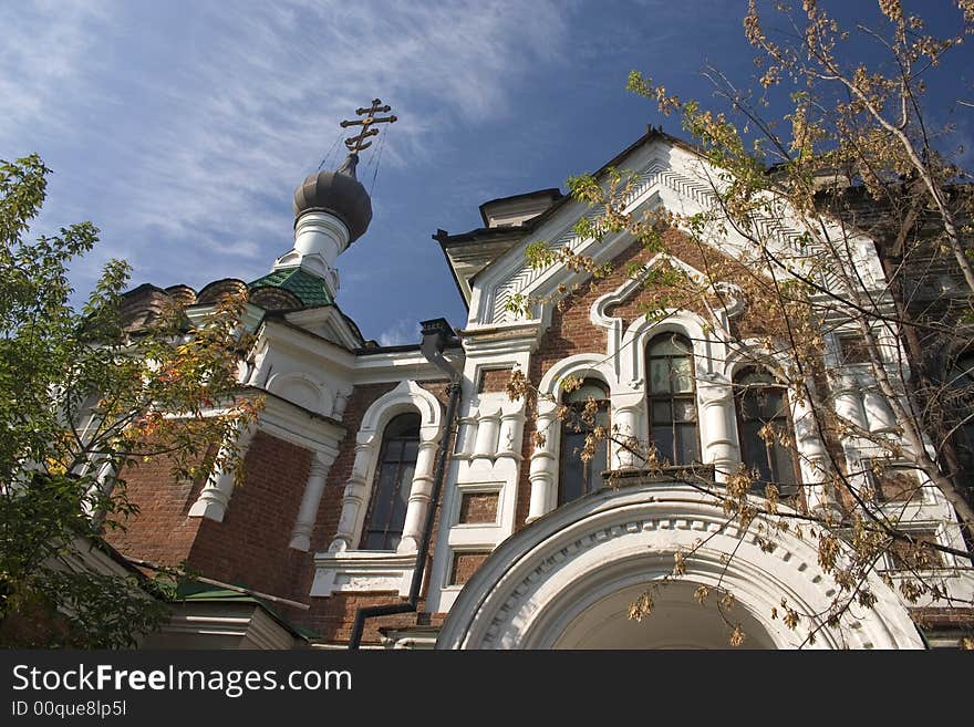 On a background of the light-blue sky church with domes. On a background of the light-blue sky church with domes.