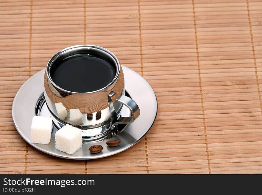 Cup of coffee on mat