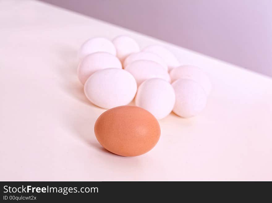 White and brown eggs on the table