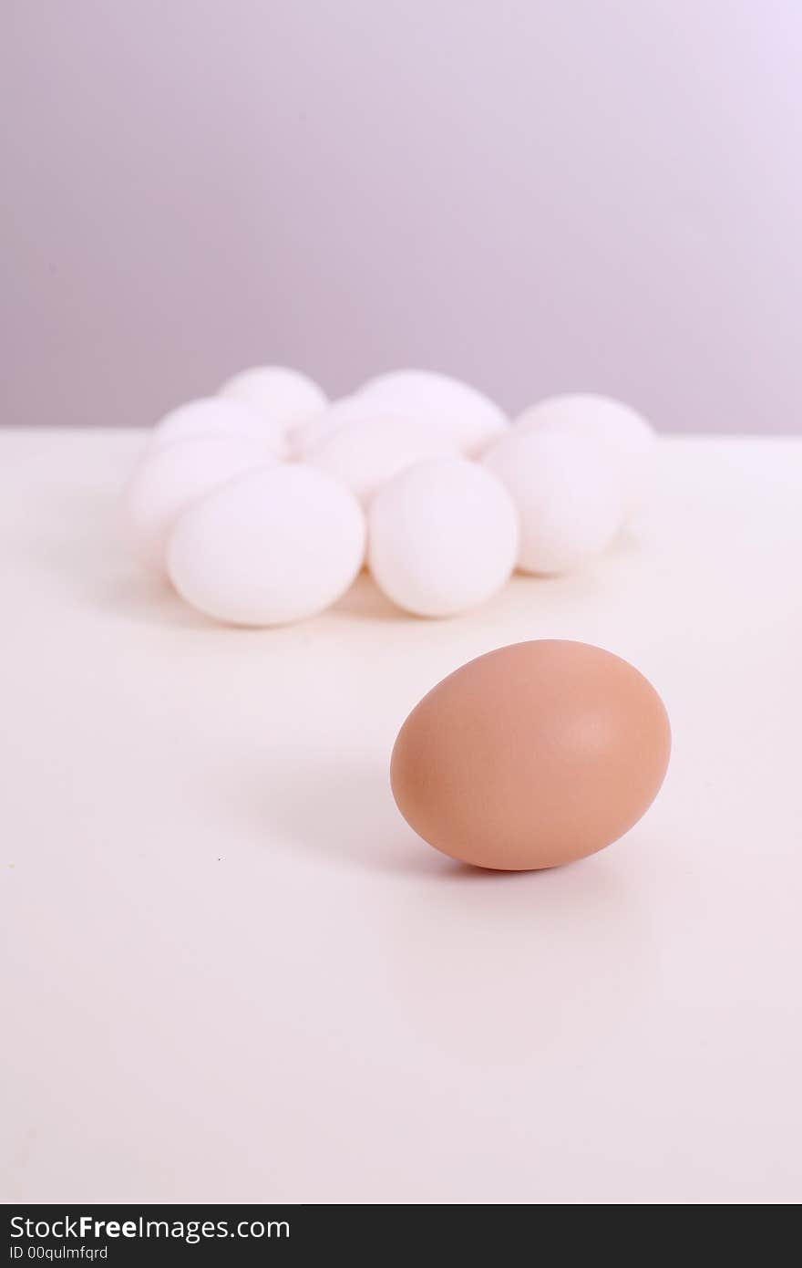 White and brown eggs on the table