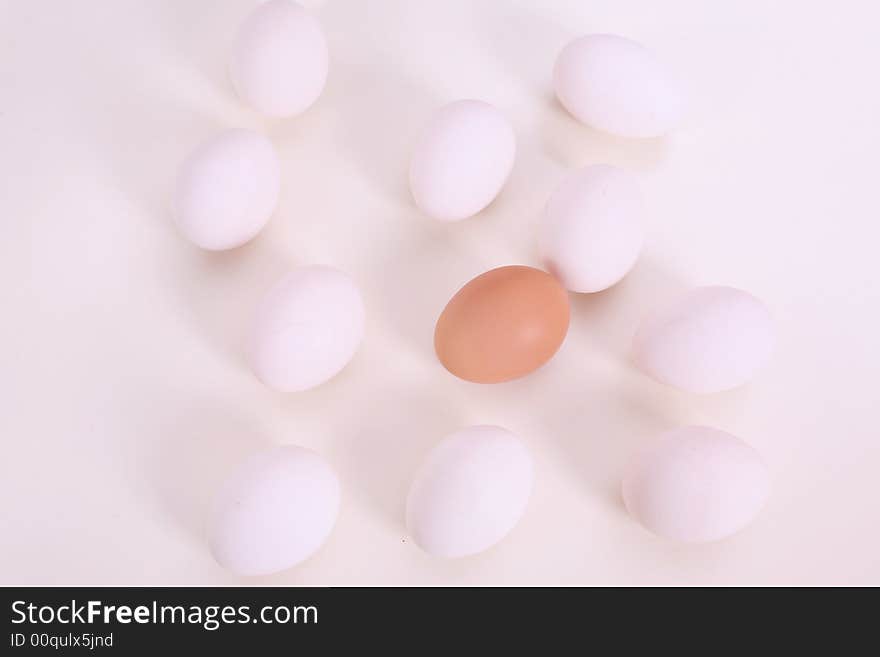 White and brown eggs on the table