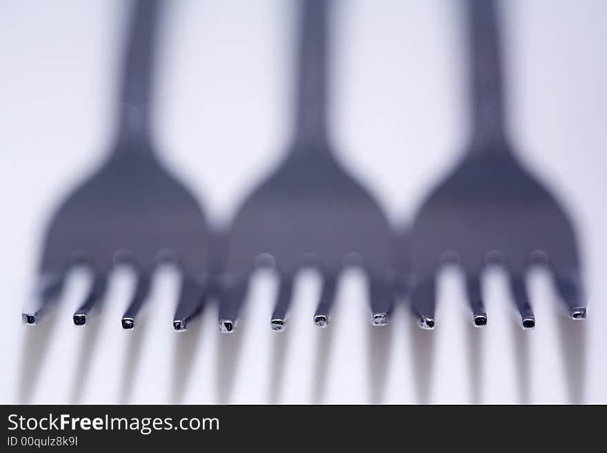 Macro photo of three forks