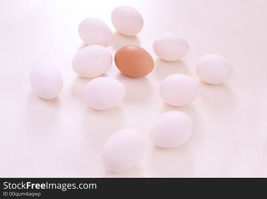 White and brown eggs on the table