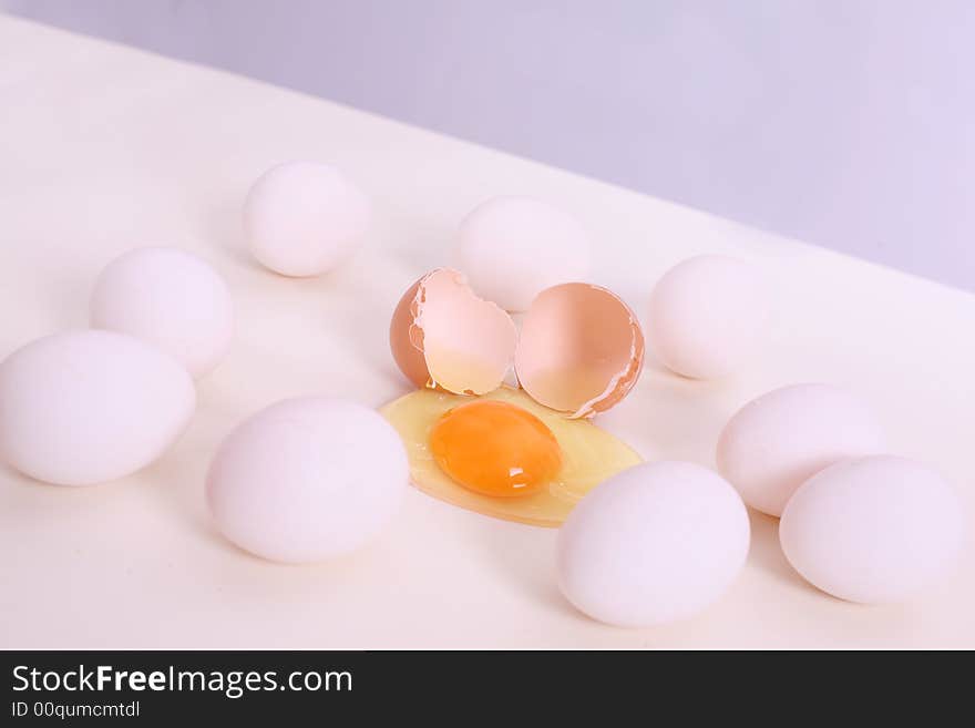 White and brown eggs on the table