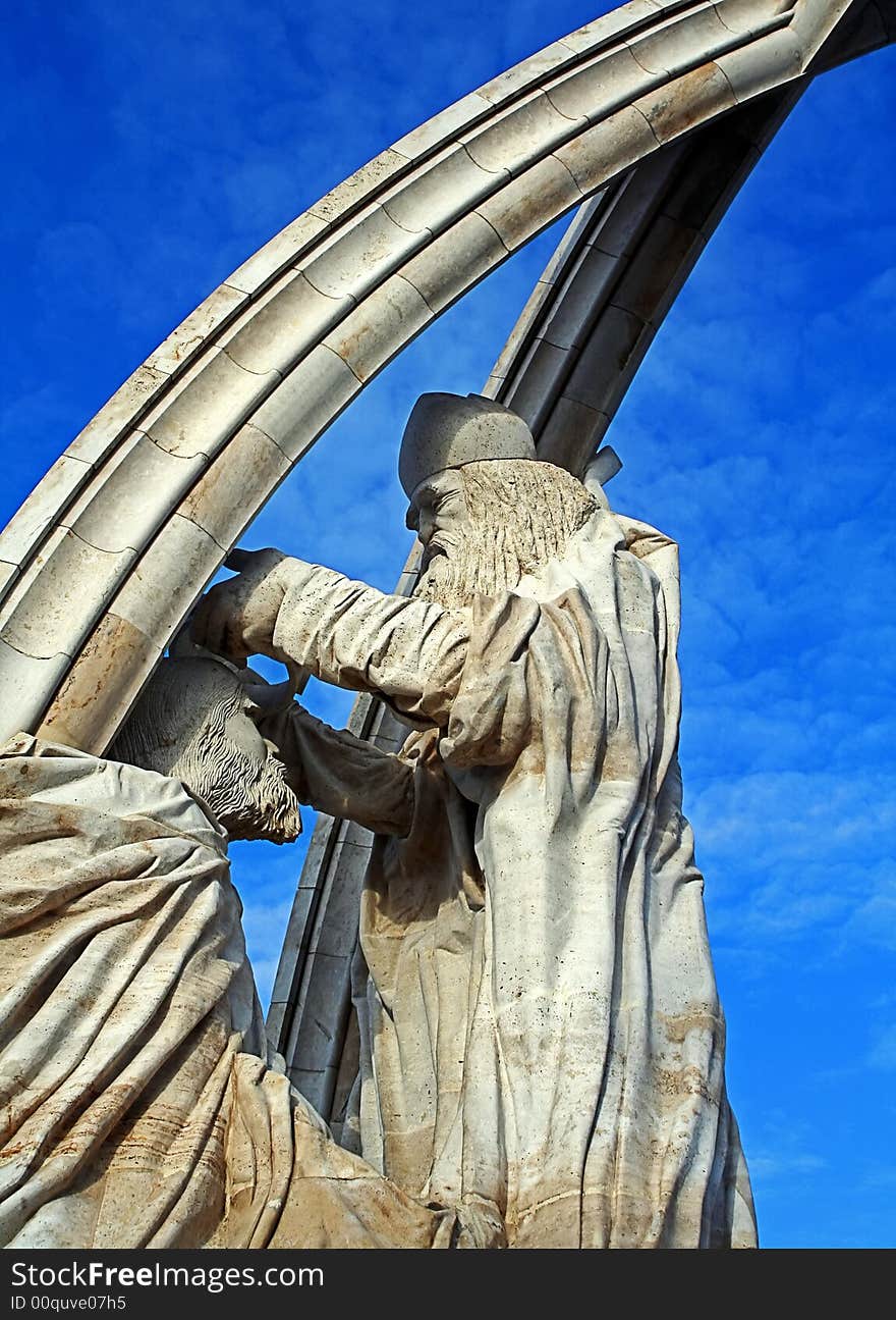 Statue of the priest , who puting a crown on ruller's head. Statue of the priest , who puting a crown on ruller's head