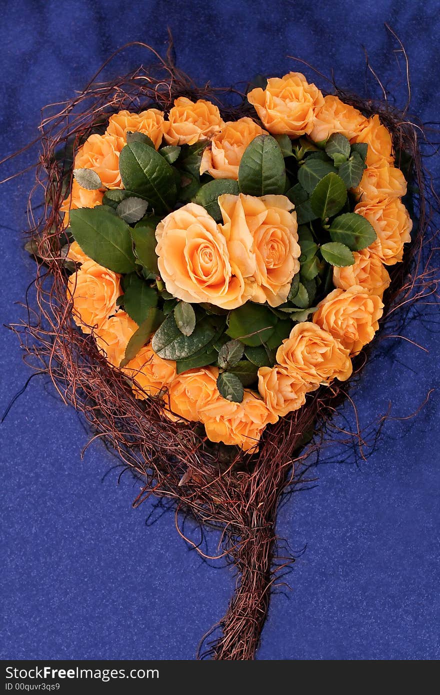 Heart of yellow roses on blue background. Heart of yellow roses on blue background