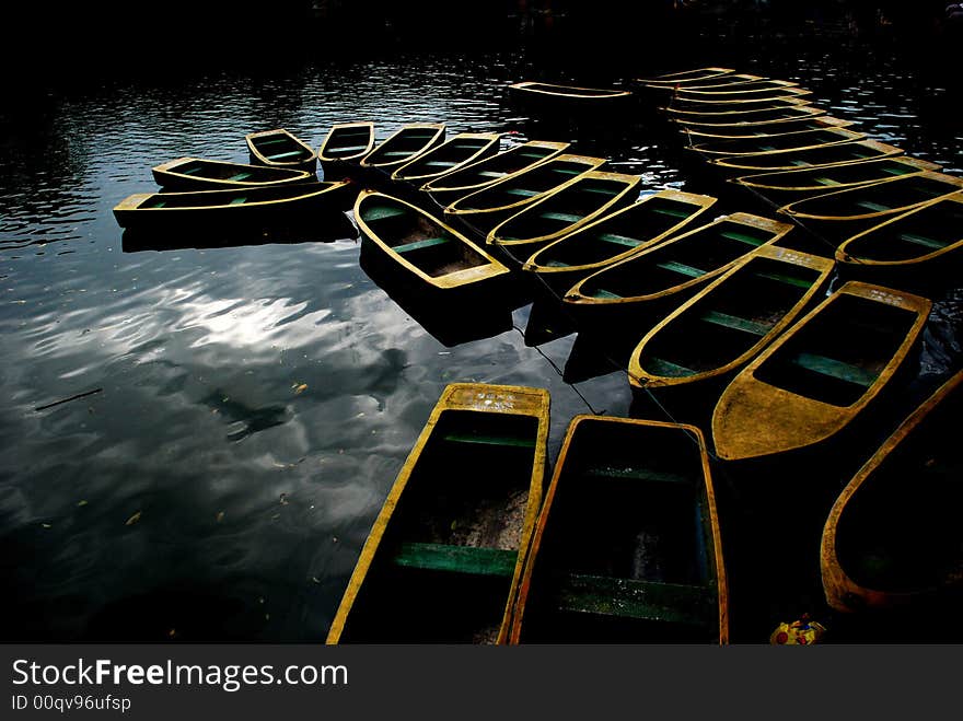 Boats anchoring at the berth of a park forming curves. Boats anchoring at the berth of a park forming curves.