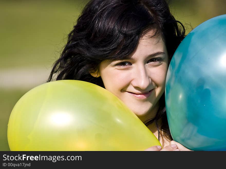 Cute girl between two colored balloons. Cute girl between two colored balloons