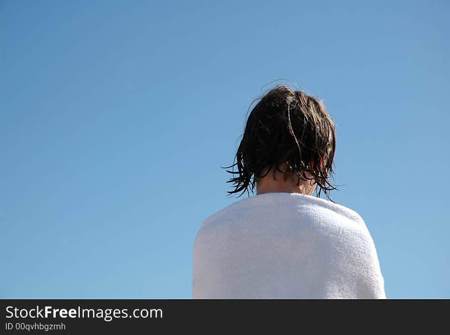 Image of child turning her back, blue sky, Nikon D70. Image of child turning her back, blue sky, Nikon D70