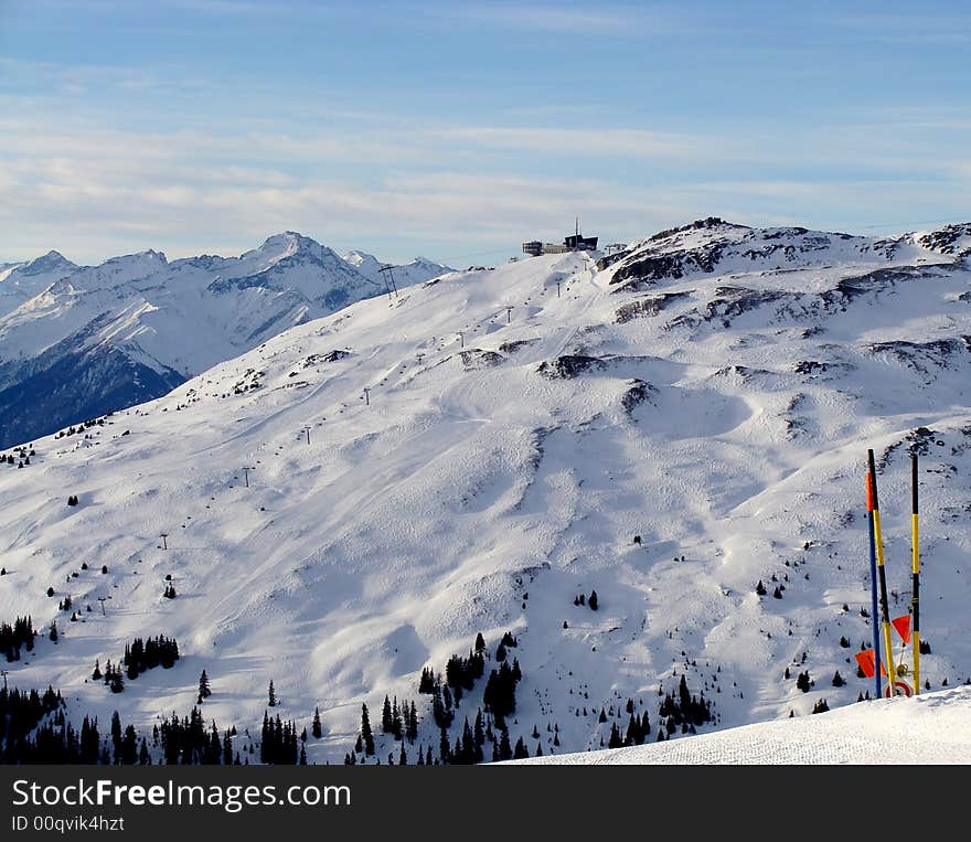 Ski Area of Flims Laax in Eastern Switzerland. Mountain, cable car station and restaurant are named Crap Sogn Gion, 2228 m / 7310 ft.