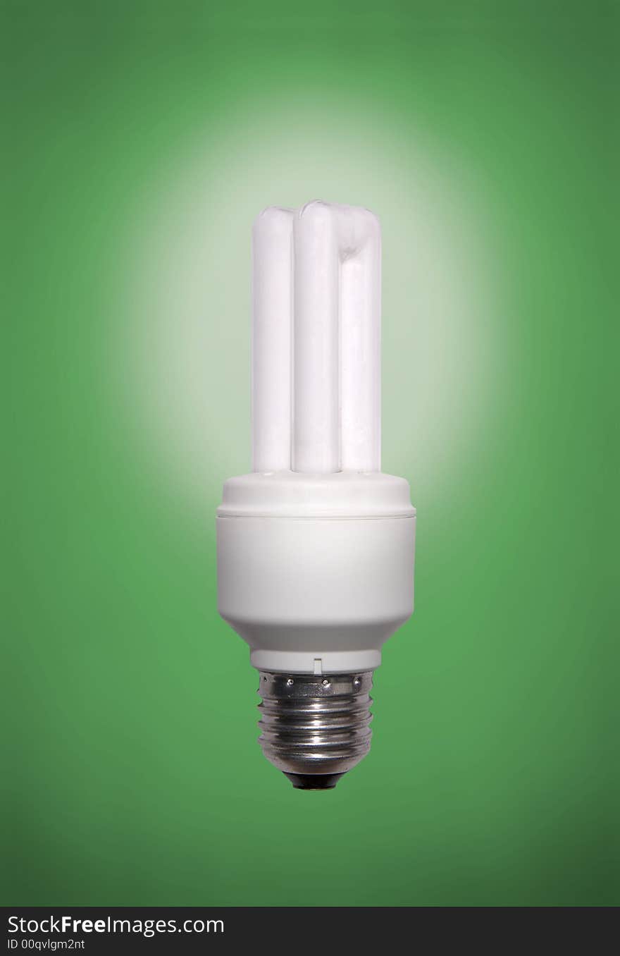 Energy saving lamp on green background. Energy saving lamp on green background