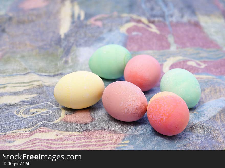 Colorful pastel Easter eggs on spring toned complimentary background. Colorful pastel Easter eggs on spring toned complimentary background