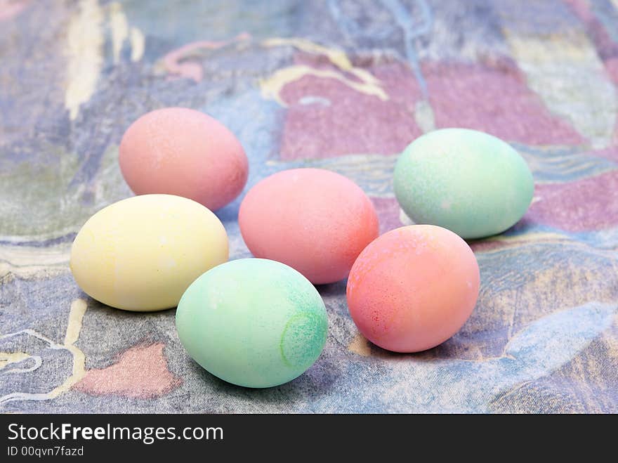 Colorful pastel Easter eggs on spring toned complimentary background. Colorful pastel Easter eggs on spring toned complimentary background