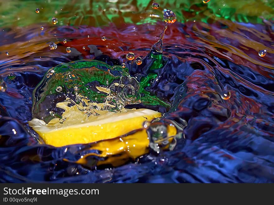 Splash with fresh mandarin. Pure water. Blue background. Splash with fresh mandarin. Pure water. Blue background.