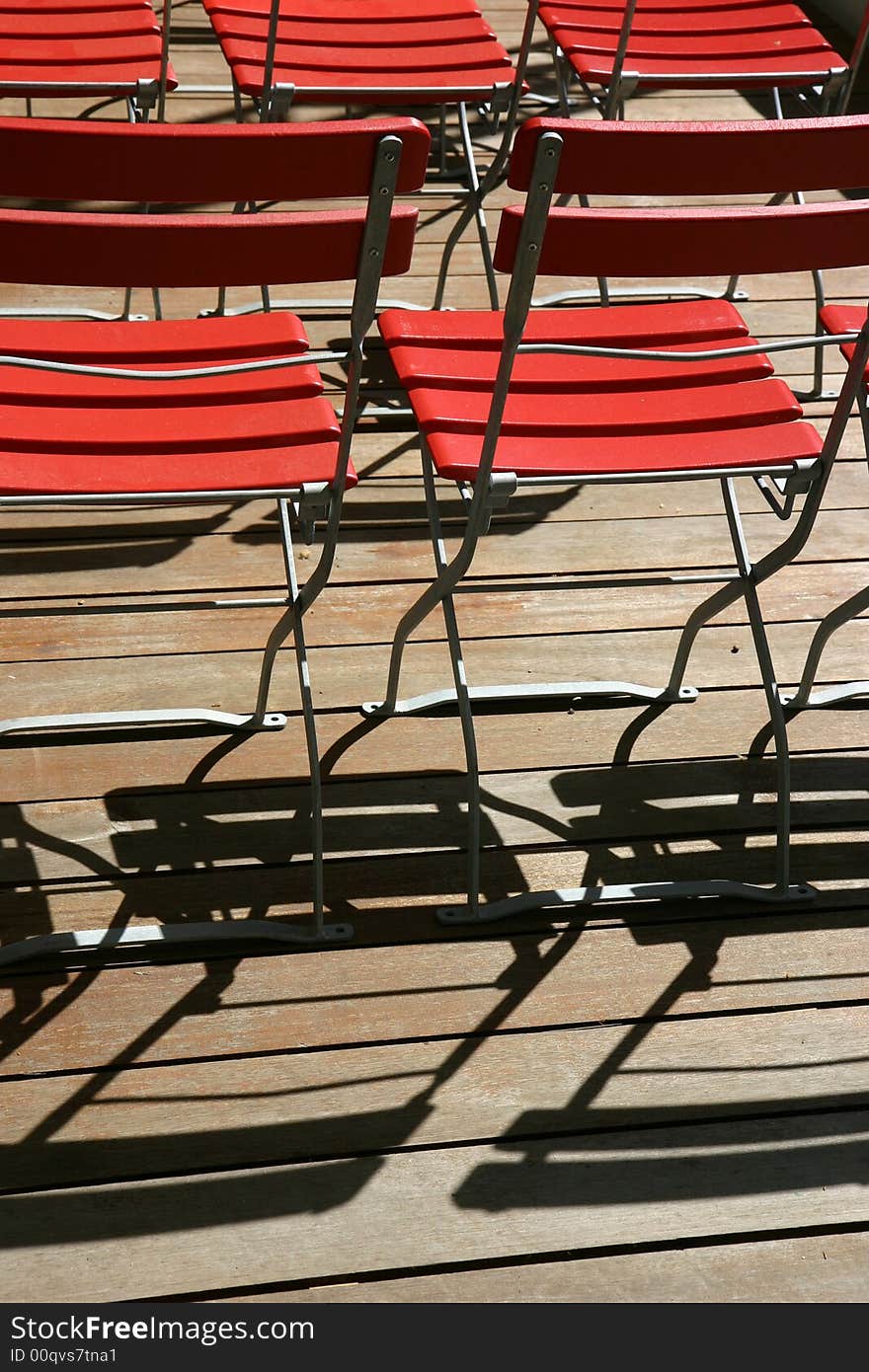 Red wooden chairs on a terrasse. Red wooden chairs on a terrasse