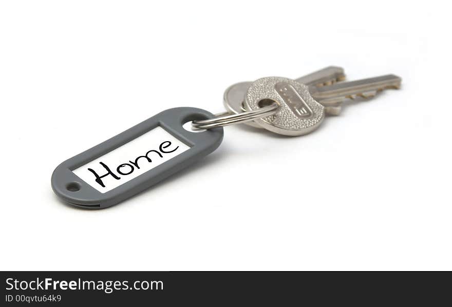 Key with home tag. Isolated on white background. Key with home tag. Isolated on white background.