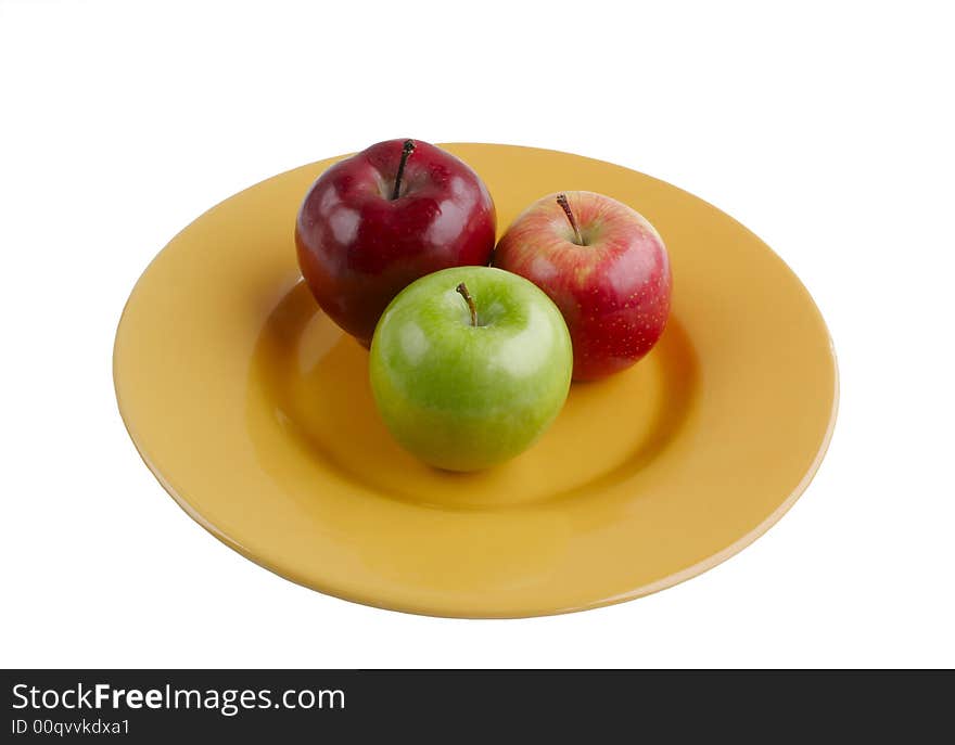 Red and Green Apples on Bright Yellow Plate Isolated on White Background. Red and Green Apples on Bright Yellow Plate Isolated on White Background