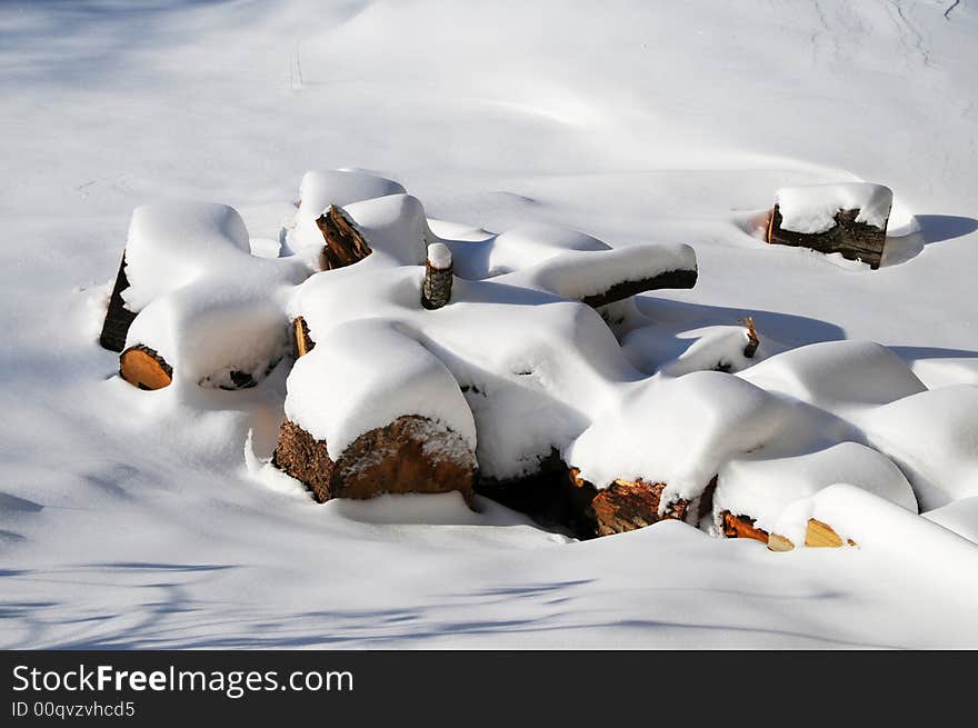 Firewood covered by snow