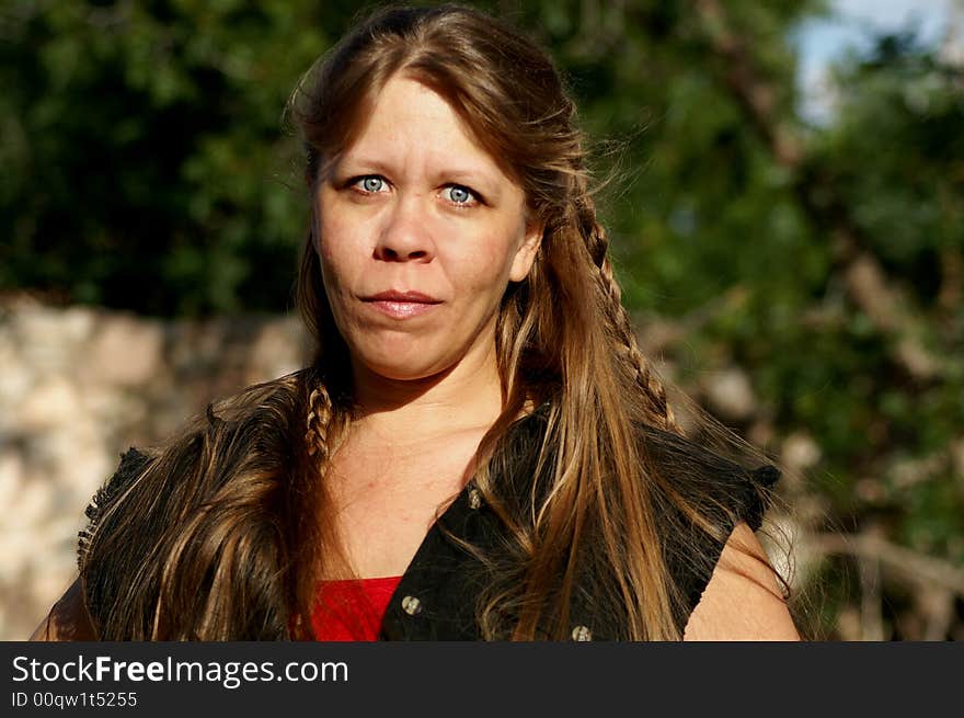 Pretty lady with long blonde hair, braids, and blue eyes. Pretty lady with long blonde hair, braids, and blue eyes.