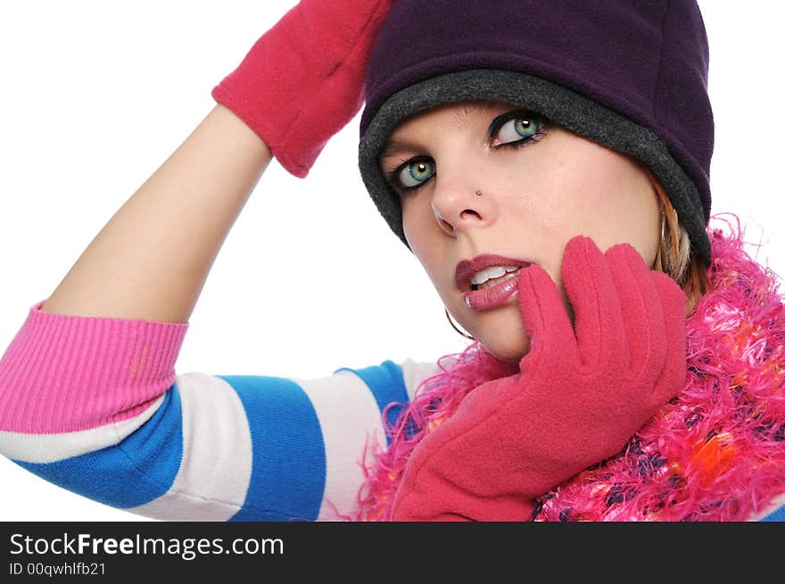 Portrait of beautiful girl in winter clothes isilated on a white background