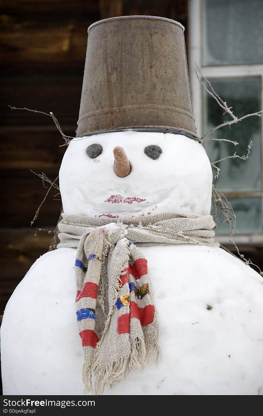 Winter. A figure made from snows with a bucket on a head. Winter. A figure made from snows with a bucket on a head.