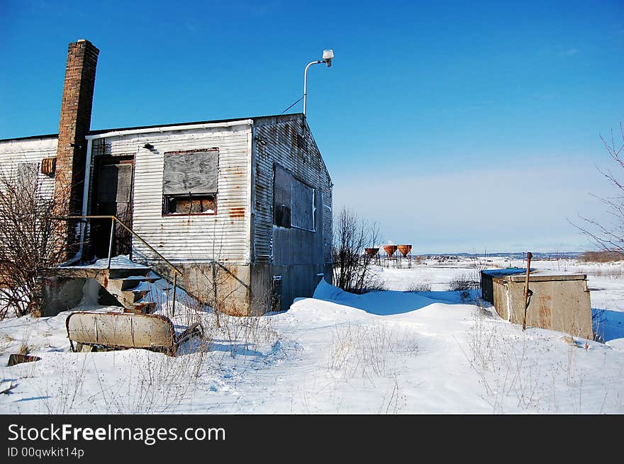 A utility building on a pier near retired coal docks. A utility building on a pier near retired coal docks.