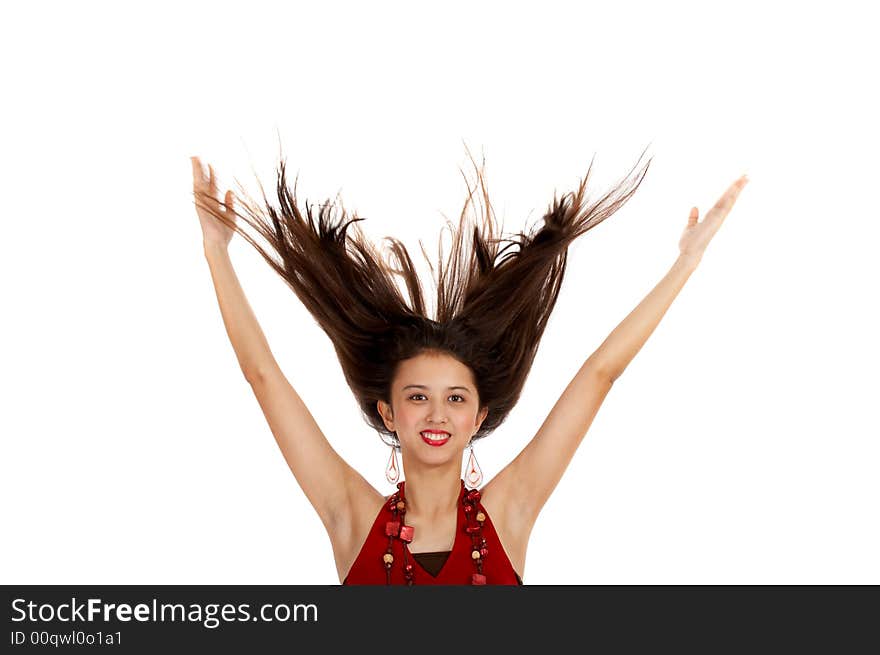 Fashionable young woman with hair flowing in the air